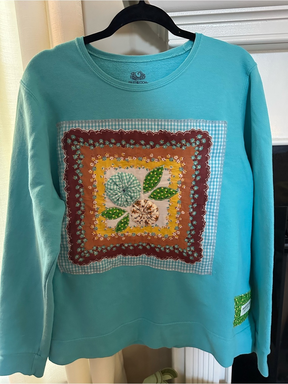 Aqua Sweatshirt with layered appliqué